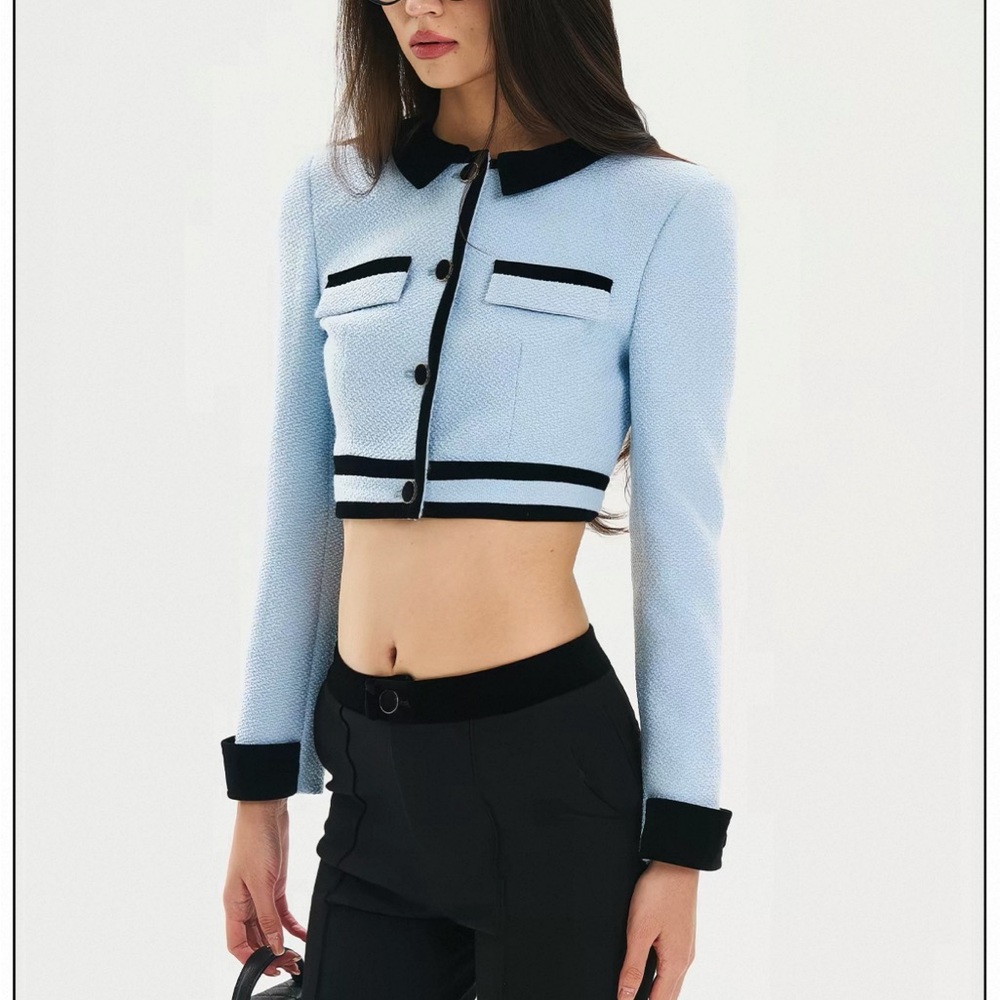 baby blue cropped tweed jacket with contrast black trim and button accents (S)